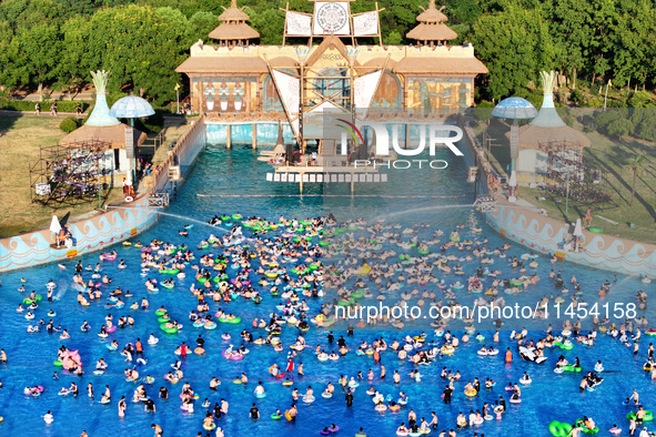 People are enjoying the cool water at a water park in Nanjing, China, on August 4, 2024. 