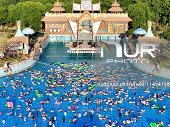 People are enjoying the cool water at a water park in Nanjing, China, on August 4, 2024. (