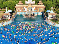 People are enjoying the cool water at a water park in Nanjing, China, on August 4, 2024. (