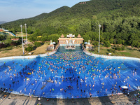 People are enjoying the cool water at a water park in Nanjing, China, on August 4, 2024. (