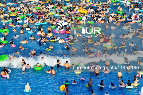 People are enjoying the cool water at a water park in Nanjing, China, on August 4, 2024. 