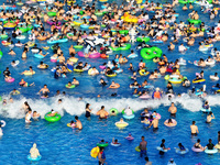 People are enjoying the cool water at a water park in Nanjing, China, on August 4, 2024. (