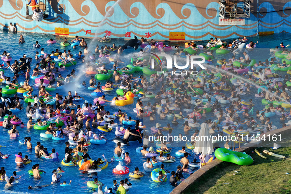 People are enjoying the cool water at a water park in Nanjing, China, on August 4, 2024. 