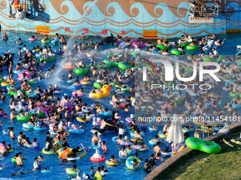 People are enjoying the cool water at a water park in Nanjing, China, on August 4, 2024. (