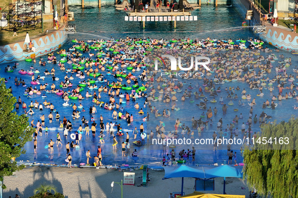 People are enjoying the cool water at a water park in Nanjing, China, on August 4, 2024. 