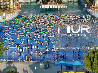 People are enjoying the cool water at a water park in Nanjing, China, on August 4, 2024. (