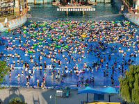 People are enjoying the cool water at a water park in Nanjing, China, on August 4, 2024. (