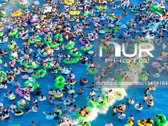 People are enjoying the cool water at a water park in Nanjing, China, on August 4, 2024. (