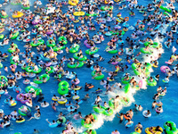 People are enjoying the cool water at a water park in Nanjing, China, on August 4, 2024. (