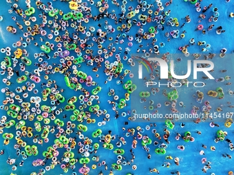 People are enjoying the cool water at a water park in Nanjing, China, on August 4, 2024. (