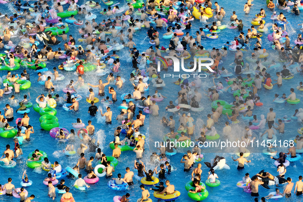 People are enjoying the cool water at a water park in Nanjing, China, on August 4, 2024. 