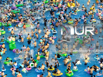 People are enjoying the cool water at a water park in Nanjing, China, on August 4, 2024. (