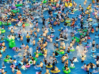 People are enjoying the cool water at a water park in Nanjing, China, on August 4, 2024. (