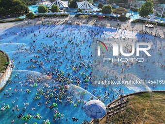 People are enjoying the cool water at a water park in Nanjing, China, on August 4, 2024. (