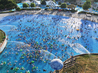 People are enjoying the cool water at a water park in Nanjing, China, on August 4, 2024. (