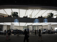 People are experiencing Huawei mobile phones at the Huawei store in Wangfujing, Beijing, China, on August 4, 2024. (