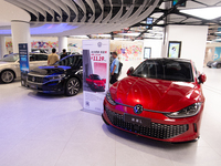 A general view is showing 70 models from Tesla, Audi, Hongqi, SAIC Volkswagen, and Jiyue Nio on display during the Auto Shopping Festival at...