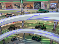 A general view is showing 70 models from Tesla, Audi, Hongqi, SAIC Volkswagen, and Jiyue Nio on display during the Auto Shopping Festival at...