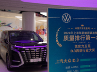 A SAIC Volkswagen auto is being displayed as 70 models from auto dealers like Tesla, Audi, Hongqi, SAIC Volkswagen, and Jiyue Nio are on dis...