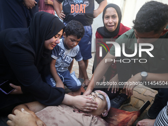 (EDITOR'S NOTE: Graphic content) Palestinians are mourning a member of their family in the aftermath of a reported overnight Israeli strike...