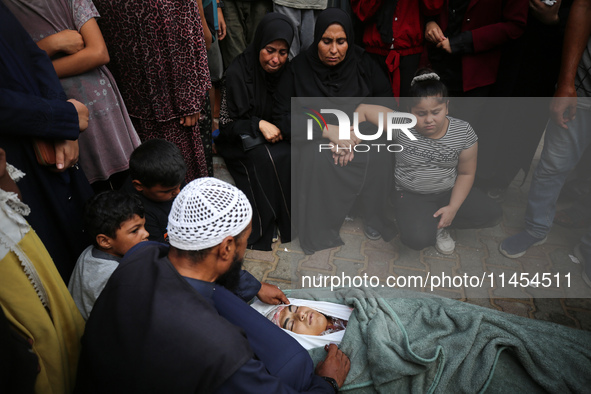 (EDITOR'S NOTE: Graphic content) Palestinians are mourning a member of their family in the aftermath of a reported overnight Israeli strike...