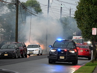 Northeast summer thunderstorms are causing havoc when lightning strikes wires, causing them to fall and a car to catch fire, prompting a mas...