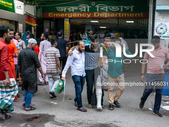 People Carried Injured Protesters To Dhaka Medical College Emergency Unit After A Clash On The First Day Of The One-point Movement Designed...