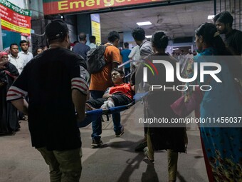 People Carried Injured Protesters To Dhaka Medical College Emergency Unit After A Clash On The First Day Of The One-point Movement Designed...