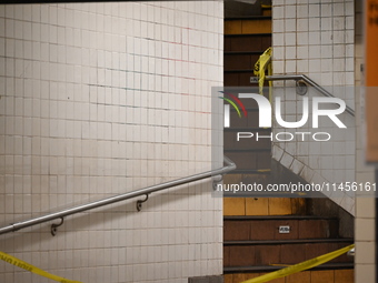 The train platform is being closed off by crime scene tape. Two females are being pushed onto the New York City subway platform by a female...