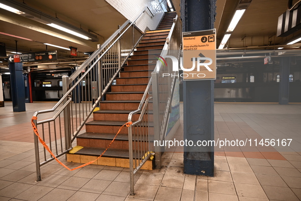 The train platform is being closed off by crime scene tape. Two females are being pushed onto the New York City subway platform by a female...