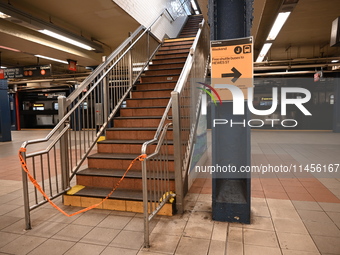 The train platform is being closed off by crime scene tape. Two females are being pushed onto the New York City subway platform by a female...