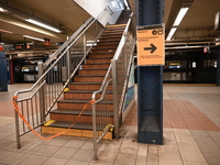 The train platform is being closed off by crime scene tape. Two females are being pushed onto the New York City subway platform by a female...