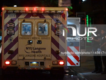 An ambulance is attending to the two female victims at the crime scene. Two females are being pushed onto the New York City subway platform...