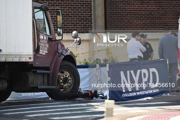 An unidentified male is riding a two-wheel device and is struck and killed by a white box truck in Queens, New York, United States, on Augus...