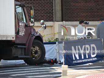 An unidentified male is riding a two-wheel device and is struck and killed by a white box truck in Queens, New York, United States, on Augus...