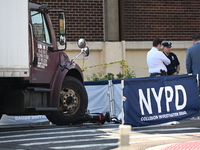 An unidentified male is riding a two-wheel device and is struck and killed by a white box truck in Queens, New York, United States, on Augus...