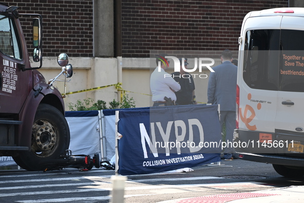 An unidentified male is riding a two-wheel device and is struck and killed by a white box truck in Queens, New York, United States, on Augus...