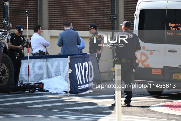 An unidentified male is riding a two-wheel device and is struck and killed by a white box truck in Queens, New York, United States, on Augus...