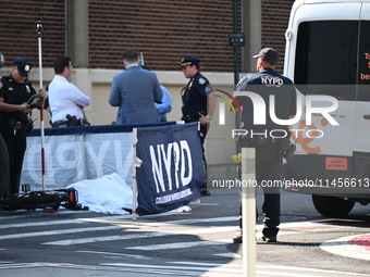 An unidentified male is riding a two-wheel device and is struck and killed by a white box truck in Queens, New York, United States, on Augus...