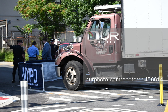 An unidentified male is riding a two-wheel device and is struck and killed by a white box truck in Queens, New York, United States, on Augus...