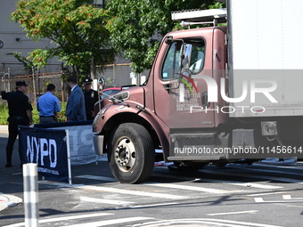 An unidentified male is riding a two-wheel device and is struck and killed by a white box truck in Queens, New York, United States, on Augus...