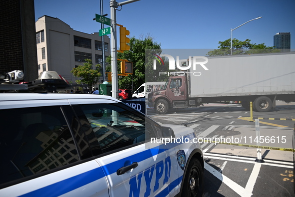 An unidentified male is riding a two-wheel device and is struck and killed by a white box truck in Queens, New York, United States, on Augus...