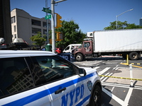 An unidentified male is riding a two-wheel device and is struck and killed by a white box truck in Queens, New York, United States, on Augus...