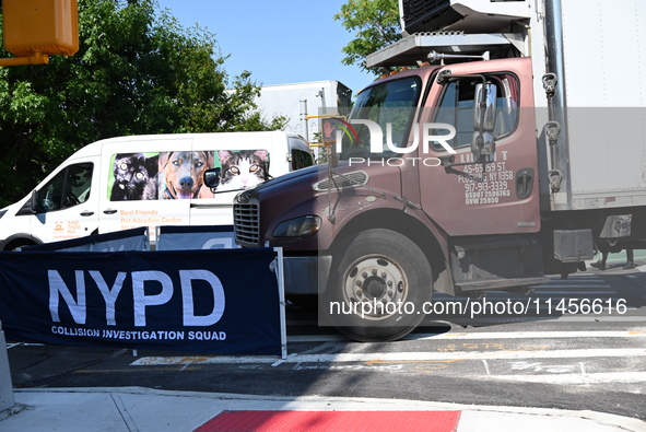 An unidentified male is riding a two-wheel device and is struck and killed by a white box truck in Queens, New York, United States, on Augus...