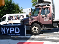 An unidentified male is riding a two-wheel device and is struck and killed by a white box truck in Queens, New York, United States, on Augus...