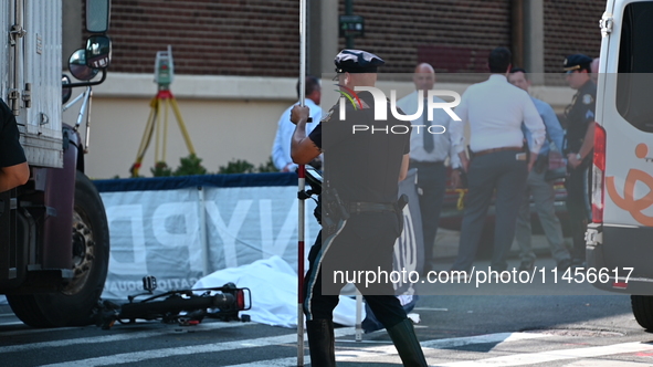 An unidentified male is riding a two-wheel device and is struck and killed by a white box truck in Queens, New York, United States, on Augus...