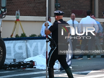 An unidentified male is riding a two-wheel device and is struck and killed by a white box truck in Queens, New York, United States, on Augus...