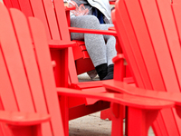 A person is napping on seating in Garden Square in downtown Brampton, Ontario, on August 5, 2024. (