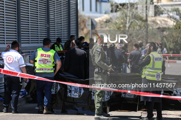 Israeli first responders are working at the site of a stabbing at the checkpoint outside of Jerusalem, Israel, on August 6, 2024, following...