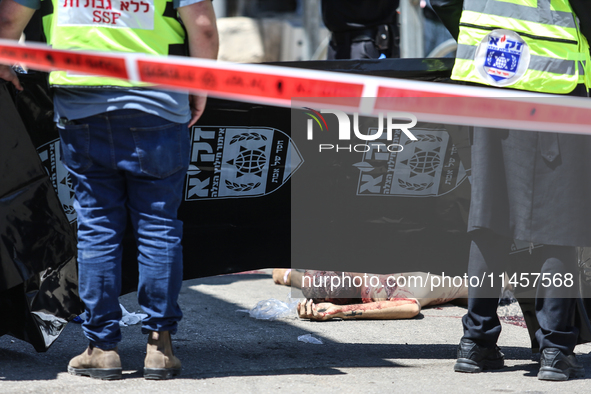 Israeli first responders are working at the site of a stabbing at the checkpoint outside of Jerusalem, Israel, on August 6, 2024, following...